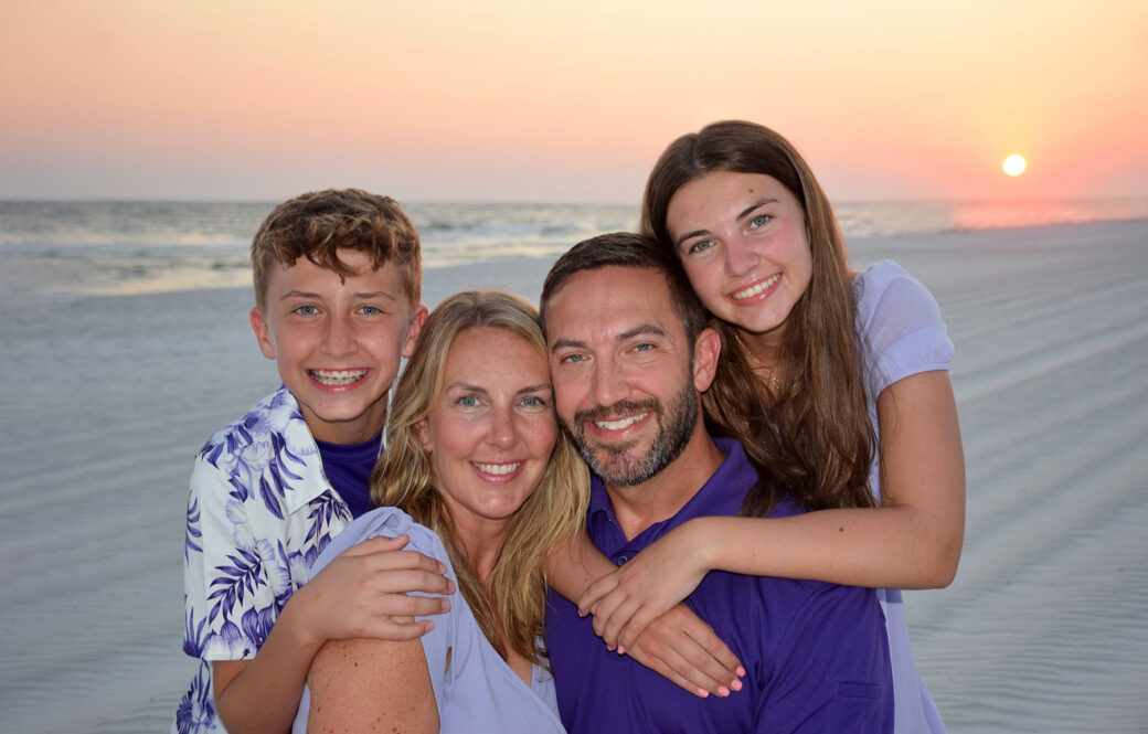 Family photographer in Panama City Beach capturing fall sunset.